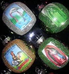 four christmas ornaments with green glitter and pictures on them