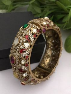 Material:  brass, CZ Stones. Suitable for all kind of outfits like Kurtis lehanga Sarees and Trousers. Arrives in a small plastic box. Highest quality of Craftsmanship. Please let me know if you any questions. Elegant Bangle For Navratri Gift, Elegant Bangle For Navratri, Elegant Cutdana Bracelets For Navratri, Elegant Beaded Bracelets For Navratri, Elegant Bangle Bracelet For Navratri, Cutdana Bangle Jewelry For Navratri, Intricate Design Bangle Bracelets For Festive Season, Navratri Intricate Bangle Jewelry, Cutdana Bangle For Navratri