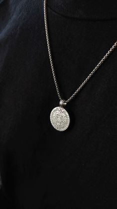 This necklace is composed of a big aztec calendar spinner coin pendant in silver filled brass, a very durable and fashionable piece that compliments any outfit. Perfect gift for him! Available in 3 chains: 1- Stainless steel ball chain 2-.Stainless steel box chain 3- Solid sterling silver 925 rolo chain 4- Stainless steel cuban chain ✺ Chain width: 2 mm ✺ Pendant length: 1.2 inch / 3 cm Available in various lengths. Measure your desired length and order accordingly.  How to find the perfect leng Sterling Silver Medallion Jewelry With Box Chain, Amulet Style Medallion Jewelry With Box Chain, Silver Chain Medallion Jewelry, Sterling Silver Amulet Medallion Necklace, Sterling Silver Amulet Coin Necklace, Silver Stainless Steel Amulet Jewelry, Engraved White Gold Pendant Coin Necklace, Silver Amulet Necklace With Round Disc, Stainless Steel Jewelry With Coin Pendant