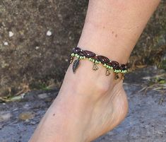 This listing is for one anklet. Beautiful macrame anklet. You can wear it alone or in combination with the barefoot sandals available in my shop (picture 2 and 4) https://www.etsy.com/listing/589470076/big-brass-flower-barefoot-sandals-green?ref=shop_home_active_2 This anklet is made with waxed polyester cord, antique bronze beads and charms and toho seed beads. They close with a lobster claw and on the other side a small chain allows to adjust the length of the anklet. The anklet comes in a bea Adjustable Macrame Bohemian Anklets, Handmade Ankle Wrap Bracelets For Festival, Handmade Ankle Wrap Anklets For Festivals, Adjustable Green Bohemian Anklets, Adjustable Bohemian Anklet Bracelet, Adjustable Hippie Anklets For Festival, Hippie Beaded Ankle Wrap Anklets, Adjustable Hippie Style Anklets For Festivals, Adjustable Macrame Anklets For Festival