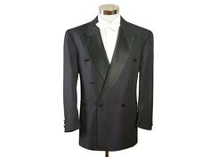 "Size: 42S / 42 Short US/UK This European vintage double-breasted dark purple tuxedo jacket has wide black peak lapels and padded shoulders and closes in the front with one black silk button (six in total show on the front). The retro formal dinner jacket has three pockets on the front and is crafted from a high-quality lightweight polyester-wool blend fabric with a diamond weave. The tux jacket is lined in a black satin viscose fabric (with four inner pockets). Note that this is a \"short\" size, which means the sleeves and the jacket length itself are slightly shorter than a regular 42. Exact measurements below. Brand label: Scherfig (Germany) Material: Polyester, Wool Condition: Excellent (Professionally Cleaned ... soft and supple, with no stains, tears, wear spots, or weaknesses in th Tailored Double-breasted Tuxedo For Formal Events, Elegant Double-breasted Tuxedo With Double Button Closure, Formal Double-breasted Long Sleeve Suit For Fall, Tailored Double-breasted Evening Suits, Double-breasted Winter Formal Suits, Formal Double-breasted Suit For Fall, Winter Double-breasted Formal Suits, Fall Evening Double-breasted Suit, Elegant Fitted Tuxedo With Double-breasted Button