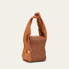 HEREU "Molta" top handle bag in leather and raffia Knot top handle, 7.1" drop Fold-over flap with magnetic closure  Approx. 7.1"H x 5.5"W x 4.3"D Dry clean Made in Spain Rectangular Straw Bag With Leather Handles For Evening, Evening Straw Bag With Leather Handles, Leather Straw Bag With Round Handle, Leather Top Handle Straw Shopping Bag, Rectangular Straw Bag With Woven Leather For Evening, Modern Leather Straw Bucket Bag, Modern Leather Bucket Straw Bag, Natural Top Handle Straw Bag With Handle Drop, Evening Rectangular Straw Bag With Woven Leather