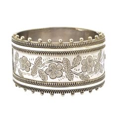 A wide hinged Victorian bangle hallmarked sterling silver, 1883. In good condition, the catch is in good working order.  The internal measurements are 5.4 cms (2 1/8 inches) x 5.1 cms (2 inches). The internal circumference is 17 cms (6 5/8 inches), The bangle is 3.2 cms (1 1/4 inches) wide, excluding the bobbles. For more bangles please look at my bracelets and bangles section here; https://www.etsy.com/uk/shop/DaisysCabinet?section_id=16212877&ref=shopsection_leftnav_6 Luxury Ornate Sterling Silver Bangle, Luxury Antique Sterling Silver Bangle Bracelet, Luxury Antique Style Sterling Silver Bangle, Antique Hinges, The Catch, Hinged Bangle, Uk Shop, Bangle Bracelets, Jewelry Bracelets