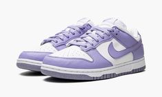 The Women’s Nike Dunk Low Next Nature “Lilac” is a women’s-exclusive colorway of the vintage basketball shoe made from at least 20% recycled content by weight.  The eye-pleasing “Lilac” colorway was released as part of the “Move to Zero” campaign by Nike that aims to reduce the brand’s carbon footprint.  The shoe features a white leather base with Lilac-colored leather overlays and Swoosh branding.  White “Nike” embroidery appears on the heel.  Lilac “Nike” and Swoosh detailing can be found on t Lavender Low-top Sneakers With Rubber Sole, Sporty Lavender Sneakers With Rubber Sole, Lavender Sporty Sneakers With Rubber Sole, Sporty Lavender Sneakers With Boost Midsole, Lavender Low-top Sneakers For Streetwear, Nike Lavender Sneakers For Streetwear, Nike Lavender Sneakers For Sports, Lavender High-top Sneakers For Streetwear, Nike Lavender Low-top Sneakers