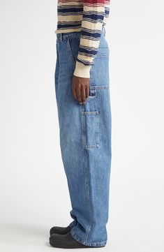 The Milanese label blends carpenter and cargo aesthetics in retro indigo-washed jeans boasting the baggy silhouette seen all over the 2024 runways. 31" inseam; 9" leg opening; 13" front rise; 15" back rise (size 48eu) Zip fly with button closure Front slant pockets; back patch pockets; cargo patch pockets 100% cotton Dry clean Made in Italy Designer Clothing Bottega Veneta Logo, New Bottega, Carpenter Pants, Cargo Jeans, Wide Leg Denim, Washed Jeans, Baggy Jeans, Denim Wash, Bottega Veneta