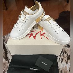 White Leather Sneaker W/Gold Logo. Never Been Worn. Size Little Too Small For Me. Cute For Travel, Errand Runs Etc. Full Inclusions. Box/Shoe Bag White Luxury Low-top Sneakers, Luxury White Sneakers With Contrast Sole, Luxury Gold Lace-up Custom Sneakers, Luxury Low-top Custom Sneakers, Luxury Custom Low-top Sneakers, Luxury White Custom Sneakers With Contrast Sole, Designer Gold Low-top Custom Sneakers, White Formal Sneakers With Contrast Sole, Designer Gold Custom Low-top Sneakers