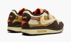 The Travis Scott x Nike Air Max 1 “Baroque Brown” is a limited edition collaboration between the hip-hop superstar and Nike that modifies the iconic retro running shoe with rugged, outdoors-inspired details.  One of two colorways of the Air Max 1 co-designed by Travis Scott and Nike in December 2021, the “Baroque Brown” does away with the tonal look that defines the “Saturn Gold” edition of Scott’s Air Max 1, and instead favors multiple earth tones.  The upper features a Lemon Drop-colored mesh Rapper Travis Scott, Retro Running Shoes, Travis Scott Cactus Jack, Jackie Brown, Nike Swoosh Logo, Cactus Jack, Nike Air Max 1, Brown Shoes, Nike Acg