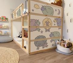 a child's bedroom with a bunk bed and stuffed animals on the floor next to it