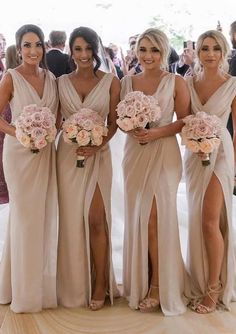 the bridesmaids are all dressed in different styles and colors, including one with thigh high slits