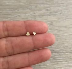 Teeny Tiny STAR Studs. They are super cute! * 1 pair * 14k Gold & Gold Filled * Star Size: 3.5 mm * Made in U.S.A. Tiny Gold Star Cartilage Earrings, Dainty Star Cartilage Earrings Gift, Cute Gold Star Jewelry, Wide Gold Ring, Minimalist Bangle, Gold Heart Stud Earrings, Hammered Gold Ring, Earring Cartilage, Gold Heart Studs