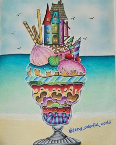 an ice cream sundae on the beach with houses and seagulls in the background