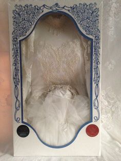 a white dress in a blue and white box