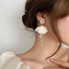 Add a whimsical touch to any ensemble with these delightful earrings that feature lovely petals and delicate white flowers. 1.38'' W x 3.23'' L Goldtone base metal / cubic zirconia / imitation pearl / mesh Church Decor, Body Chain Jewelry, Girly Jewelry, Accessories Jewelry Earrings, Bridal Earrings, Base Metal, White Flowers, Jewelry Box, Cubic Zirconia