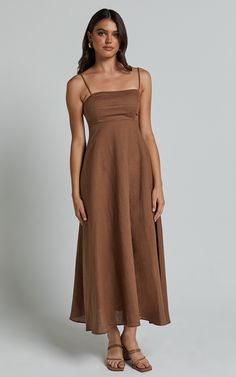 Elevate your summer wardrobe with the Brette Midi Dress in Tobacco. This stunning linen look dress features a flattering sweetheart neckline and stylish strappy details, making it perfect for both casual occasions and special events. The fit and flare silhouette accentuates your curves while providing a comfortable and breezy feel. Made from high-quality linen fabric, this sleeveless dress is ideal for staying cool on those hot days. Whether you're heading to brunch or a beach party, the Brette Dress Linen, Linen Dresses, Beach Party, Fit And Flare Dress, Summer Wardrobe, Sweetheart Neckline, Flare Dress, Linen Fabric, Midi Length