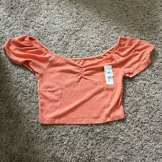 Super Cute Coral Colored Top. Great For Summer!! Never Worn Just Doesn’t Fit Me!! Stretch Ruffle Crop Top, Ruffled Stretch Crop Top, Casual Stretch Crop Top With Puff Sleeves, Trendy Ruched Short Sleeve Crop Top, Casual Ruched Crop Top With Puff Sleeves, Trendy Short Sleeve Ruched Crop Top, Trendy Ruched Puff Sleeve Tops, Trendy Puff Sleeve Ruched Tops, Stretch Crop Top With Ruffles And Short Sleeves