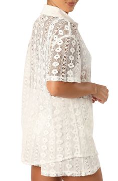 Intricate lace and an oversized fit lends summery charm to this sheer short-sleeve button-up. Front button closure Spread collar Short sleeves Sheer 100% cotton Hand wash, dry flat Imported Chic Short Sleeve Scalloped Lace Top, Chic Scalloped Lace Short Sleeve Top, Short Sleeve Lace Top For Summer, Bohemian Short Sleeve Lace Top For Spring, Bohemian Spring Lace Top With Short Sleeves, Chic Short Sleeve Blouse With Scalloped Lace, Chic Scalloped Lace Short Sleeve Blouse, Summer Scalloped Lace Top, Casual Lace Blouse With Short Sleeves