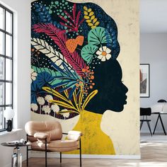 a woman's head with flowers and leaves painted on the wall in an office