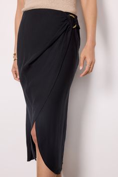 A chic warm-weather essential, the Sampha skirt by Rails features a faux-wrap silhouette with a ring detail and hidden elastic waistband. Style with a button-down and sandals during the day, then switch to a tank and heels for a nighttime look. Luxury Relaxed Asymmetrical Hem Wrap Skirt, Black Long Lined Wrap Skirt, Black Linen Wrap Skirt, Fitted Black Asymmetrical Wrap Skirt, Luxury Black Relaxed Wrap Skirt, Rails Clothing, Exclusive Dress, During The Day, Fashion 101