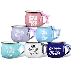 six coffee mugs with different designs and sayings on the front, one has a bow