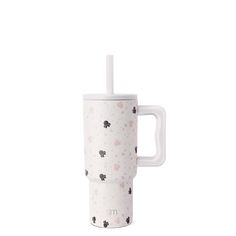 a white cup with a straw sticking out of it's side, on a white background