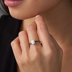 With luxurious contrast, this sensational fashion ring is destined to be admired. Crafted in sterling silver, this sumptuous style features an 8.0 x 6.0mm oval-shaped lab-created iridescent opal cabochon atop an alluring black diamond-lined shank. Captivating with 1/5 ct. t.w. of diamonds and a brilliant buffed luster, this design is a fabulous choice for day or night. Custom-made to fit her ring size. Sterling silver rings cannot be resized after purchase. Her Ring, Peoples Jewellers, Black Diamond Ring, Fashion Ring, Oval Stone, Black Stone, Diamond Stone, Black Diamond, Prong Setting