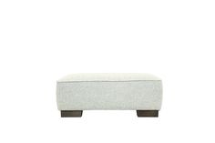 a white ottoman with wooden legs on a white background