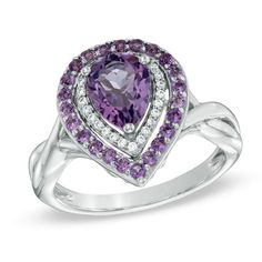 On her February birthday, express your affection with this exquisite amethyst and diamond fashion ring. Expertly crafted in sleek sterling silver, the eye is drawn to the 8.0 x 6.0mm pear-shaped bright purple amethyst center stone. A double border of shimmering round accent diamonds and glistening round amethyst accents surrounds the center stone. The ring's cleverly twisting shank completes the design. A look she'll treasure, this ring captivates with 1/10 ct. t.w. of diamonds and a polished sh Elegant Amethyst Diamond Ring With Gemstone Accents, Elegant Purple Diamond Ring With Gemstone Accents, Elegant Purple Diamond Ring With Center Stone, Elegant Amethyst Ring With Gemstone Accents For Anniversary, Elegant Purple Birthstone Ring With Center Stone, Elegant Purple Diamond Ring For Anniversary, Fine Jewelry Purple Rings With Diamond Accents, Purple Diamond Ring With Gemstone Accents, Classic Purple Diamond Ring With Halo Setting