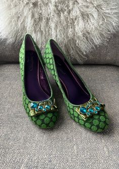 A pretty pair of green polka dot shoes, blue jeweled on a green ribbon at the toe. Besides their beauty, they're barely worn. Made in London by Poetic License, this pair is EUR size 39 1/2, 8 1/2 American. Says so on the inside of the shoe. Pretty much art for feet. Comfy too! Green Rhinestone Heels For Wedding, Green Rhinestone Wedding Heels, Green Rhinestone Open Toe Heels, Green Rhinestone Round Toe Heels, Green High Heels With Rhinestones, Green Embellished Open Toe Heels, Green Slip-on Evening Heels, Green Evening Slip-on Heels, Embellished Green Heels For Evening