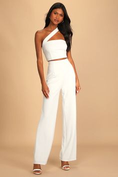 You'll feel like showing off in the Lulus Flaunt It Like That White One-Shoulder Two-Piece Jumpsuit! Thick crepe stretch knit shapes this two-piece jumpsuit that has a crop top with a one-shoulder neckline (with no-slip strips) and an asymmetrical cutout design. Exposed silver zipper at back. The matching pants have a high, banded waist and straight legs that end at ankle-length hems. Hidden back zipper/clasp. White Jumpsuit Outfit, White Jumpsuit Wedding, White Party Outfit, Shower Outfits, White Two Piece, Bridal Jumpsuit, Two Piece Jumpsuit, Wedding Jumpsuit, One Shoulder Jumpsuit