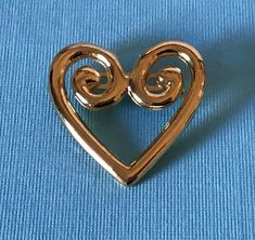 Vintage gold tone heart brooch                              020920Pin is in good condition. Please see pictures for exact condition and sizeIt comes from a clean, smoke free home.I ship quickly and offer free domestic shipping to the United States.**Buyers in the United Kingdom, please be aware that if you spend over 15 GBP, there are custom charges and handling charges from Royal Mail.Thanks for looking Please read our return policy before purchasing. We package well and ship quickly! Vintage Gold Heart Brooches, Gold Heart-shaped Brooch For Formal Occasions, Gold Heart Brooch For Formal Occasions, Gold Heart Brooch For Formal Wear, Gold Brooches For Valentine's Day, Gold Brooches For Valentine's Day Formal, Heart-shaped Gold Pins For Gifts, Gold Brooches For Formal Valentine's Day, Gold Heart-shaped Brooches For Gifts