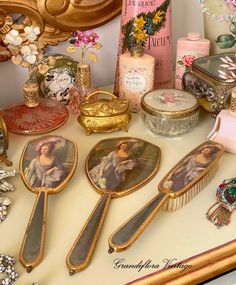 a table topped with lots of antique items