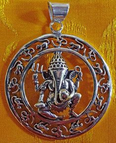 Ganesha with Om circle Pendant. Size: 1.5" diameter pendant. Made from beautiful brass. Om Pendant, Buddhist Prayer, Prayer Flags, Singing Bowl, Singing Bowls, Mala Beads, Ethnic Jewelry, Circle Pendant, Brass Chain