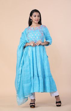 This stunning Premium Cotton Leheriya Print Anarkali Set is embroidered and hand-crafted by our in-house design team This stunning blue leheriya print anarkali suit is made of pure cotton fabric, and comes with a dupatta, anarkali top, and straight pants. This suit is ready to ship.Fabric: CottonWashing instructions: Hand WashModel is wearing size Small Kurta length: 46 inches Blue Mulmul Anarkali Set With Straight Kurta, Blue Cotton Anarkali Set For Eid, Blue Mulmul Anarkali Set For Eid, Blue Cotton Anarkali Set With Cutdana, Cotton Anarkali Sharara With Resham Embroidery, Blue Anarkali Salwar Kameez In Mulmul, Blue Anarkali Set In Mulmul Fabric, Semi-stitched Cotton Dress With Gota Work, Blue Anarkali Set With Dupatta In Mulmul