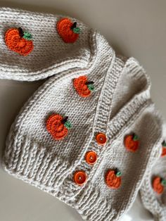 there are several pairs of socks with orange flowers on them, and one pair is white