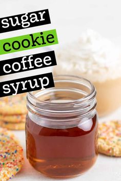 a jar of sugar cookie coffee syrup next to cookies