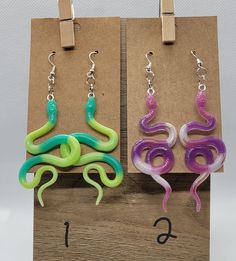 Handmade resin snake earrings. Hypoallergenic hook earrings. Please contact if you would like to custom order color/s. Handmade Unique Plastic Jewelry, Handmade Plastic Dangle Jewelry, Handmade Snake Shape Earrings, Snake-shaped Earrings With Ear Wire For Gift, Snake-shaped Earrings With Ear Wire As Gift, Handmade Snake-shaped Earrings As Gift, Trendy Snake-shaped Earrings For Gifts, Earrings Hypoallergenic, Snake Earrings