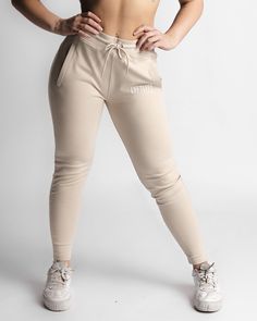 High-waisted stretchy joggers Relaxed tapered fit with a tighter ankle Comfortable elasticized waistband Concealed front pockets with zipper closure Color-matching drawstrings and trims 3D Rubberized “LYFTLYFE” logo and branded drawstring caps 57% cotton/37% polyester/6%Elastane Created with perfect tapering and shape retention qualities these women’s joggers are a necessity for your wardrobe. Designed to move with you while showcasing your best assets! Constructed from a soft and lightweight ul White Jogger Pants, White Joggers, Joggers Pants, Joggers Womens, Jogger Pants, Stretch Cotton, Color Matching, Athleisure, Tights