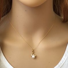 Description: 14k Solid Gold Mini Pearl Pendant Dainty Necklace - Minimalist Item No.: Pw12/6814 Metal Type: 14k Solid Gold Metal Color: Yellow Gold. Stones: Pearl And Cubic Zirconia Measurement: 16"-19" Adjustable Length Chain. Pendant: Pearl: 5 Mm Est. Total Weight: 2.01 Grams (1.1 Pendant + 0.91 Chain) Note: Matching Earrings Are Available For Sale In Another Listing. Elegant Gold Plated Yellow Gold Pearl Necklace, Luxury 14k Yellow Gold Pearl Necklace, Elegant Yellow Gold Plated Pearl Necklace, Elegant Yellow Gold-plated Pearl Necklace, Formal 14k Yellow Gold Pearl Necklace, Timeless Wedding Necklace With Birthstone, 14k White Gold Necklaces With Pearl Drop, Elegant 14k Gold Pearl Necklace In Gold, Elegant 14k Gold Jewelry With Pearl Charm