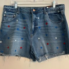 Cute Pair Of Summer Shorts! Medium Wash High-Rise Raw Hem Red, White And Blue Stars Embroidered On Front. Pockets Front And Back Measurements Laid Flat: Waist-18” Length-15” Inseam-3.5” Rise-12.5” Casual Bottoms With Star Patch, High Rise Cotton Bottoms With Star Print, Trendy Cotton Jean Shorts With Star Print, Denim Jean Shorts With Star Print, Blue Star Print Short Bottoms, Summer Denim Shorts With Star Print, High Waist Jean Shorts With Star Print For Summer, Casual High Waist Jean Shorts With Star Print, Blue Shorts With Star Print