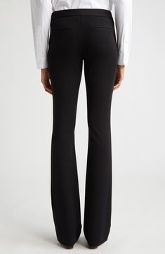 Staple black trousers fit slim through the leg before kicking out into a fun flare at the hem. 33 1/2" inseam; 22" leg opening; 10" front rise; 16" back rise (size 16) Zip fly with hook-and-bar closure Back welt pockets Lined 68% viscose, 28% polyamide, 4% elastane Dry clean Imported Designer Clothing Fitted Mid-rise Formal Pants, Formal Fitted Mid-rise Pants, Slim Fit Mid-rise Formal Pants, Fitted Bottoms For Business Casual With Standard Cut Leg, Classic Flare Stretch Pants, Classic Flared Stretch Bottoms, Classic Stretch Flare Pants, Classic Fitted Flare Dress Pants, Black Flare Pants In Elastane