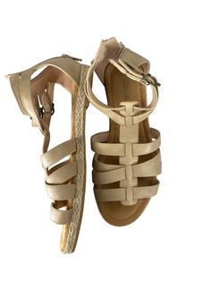 Brand: CLOTHES MENTOR Style: SANDALS FLATS Color: TAN Size: 6 Other Info: SHIBEVER - SIZE 36 SKU: 186-186278-19482 CONDITION: GENTLY USED Beige T-strap Sandals For Summer Beach, Adjustable Beige T-strap Sandals For Vacation, Beige T-strap Sandals With Ankle Strap For Vacation, Beige T-strap Sandals For Beach In Spring, Beige T-strap Sandals For Spring Beach Outings, Casual Closed Toe T-strap Sandals For Beach Season, Beige T-strap Sandals For Spring Beach Occasion, Casual Closed Toe T-strap Sandals For Beach, Spring Beach Beige T-strap Sandals