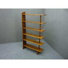 a wooden shelf with three shelves on each side