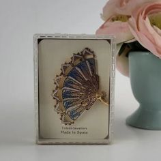 "A very rare, articulated, metal damascene fan brooch, signed Spain. Blue enamel and gold plated. Gift for her. Collectible Vintage jewelry. Elegant woman. The segments have beautiful gold tone, embossed buildings designs, on a bright blue enamel background, with white enamel accents. Each segment is 9/16\" wide and there are 7 segments. It is 2&3/4\" wide (fully open), 2\" high, and 1/2\" thick. Believe this is from the 80s, purchased from an estate. Excellent pre-owned condition, I do not beli