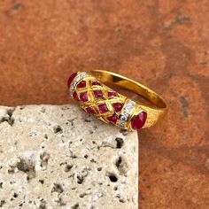 Estate/ vintage 18KT yellow gold Etruscan/ Byzantine design band ring with genuine cabochon red ruby and diamond gemstones. Size: 6.5 Measures: 6.5mm wide 10 Tiny Diamonds .005 carat Weight: 3.90 Grams Stamped 18K Vibrant gold color, almost looks like 22KT Excellent condition Fine Jewelry Ruby Cabochon Ring, Luxury Cabochon Ruby Ring For Anniversary, Anniversary Yellow Gold Cabochon Diamond Ring, Gold Cabochon Diamond Ring Fine Jewelry, Traditional Ruby Ring In Yellow Gold, Traditional Yellow Gold Ruby Ring, Fine Jewelry Ruby Cabochon Ring For Anniversary, Fine Jewelry Cabochon Ruby Ring For Anniversary, Traditional Yellow Gold Ruby Ring With Gemstone