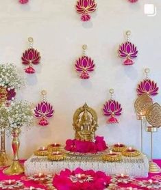 a decorated table with pink and gold decorations