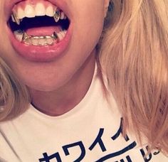 vampire grillz, single tooth grill, silver tooth, silver teeth, silver mouth grillz, CZ diamond Gold Fangs, Girl Grillz, Fang Grillz, Grillz Teeth, Gold Grill, Studera Motivation, Gold Grillz, Mode Hijabi, Grills Teeth