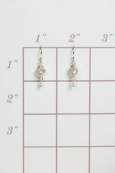 A beautiful gift for those born in April, featuring their birthstone of stunning quartz that is hand wrapped in sterling silver wire. These feminine earrings dangle from sterling silver earwires. Sterling Silver (lead and nickel free) Quartz .75", on sterling silver earwires We hand select our natural materials, thus there may be slight variations in color and/or size that will not detract from the overall aesthetic Our unique handcrafted designer jewelry for women is made in America, with each Everyday Sterling Silver Wire Wrapped Jewelry, Adjustable Hypoallergenic Sterling Silver Wrap Earrings, Silver Dangle Wire Earrings, Silver Teardrop Wrap Earrings As A Gift, Silver Teardrop Wrap Earrings For Gift, Silver Hypoallergenic Wrap Earrings For Gift, Silver Adjustable Hypoallergenic Wrap Earrings, Adjustable Silver Crystal Earrings As Gift, Elegant Adjustable Wire Wrap Earrings