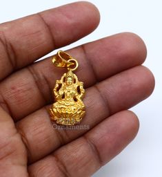 925 sterling silver handmade custom design vintage antique style Indian Hindu Goddess Laxmi pendant, this is special leaf Ganesh design pendant, best wishes blessing gift for your special person, excellent jewelry from India. Metal-925 sterling silver. Item type-Pendant. Length-3.8 centimeters. Width-1.5 centimeters. Weight-4.250 grams. Stamped-925. Finish-Gold polished over 925 silver Make excellent gifting and collectible pieces(gift for birthday, wedding, anniversary, mother's day, fathers da Laxmi Gold Pendant, Lakshmi Devi Pendants Gold Small, 22k Gold Polished Jewelry Gift, 22k Gold Jewelry With Polished Finish As Gift, 22k Gold Jewelry With Polished Finish For Gift, Spiritual 22k Gold Round Pendant Jewelry, 22k Gold Spiritual Round Pendant, 22k Gold Spiritual Round Pendant Jewelry, Gold Plated Pendant Jewelry For Puja