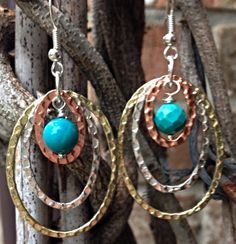 Tri Color Hammered Hoops Dangle a turquoise bead by ShalomJewelry Turquoise Metal Hoop Earrings, Nickel-free Turquoise Metal Hoop Earrings, Turquoise Metal Round Hoop Earrings, Turquoise Dangle Hoop Earrings Wire Wrapped, Turquoise Wire Wrapped Dangle Hoop Earrings, Nickel-free Turquoise Dangle Hoop Earrings, Turquoise Hoop Metal Jewelry, Turquoise Metal Hoop Jewelry, Turquoise Dangle Hoop Earrings Nickel Free