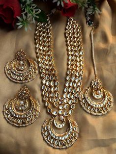 Adorn your beautiful personality with this exquisitely designed and handcrafted gold toned Kundan  necklace  ,chandbalis and maangtika combo set  lined with fine  pearls . Pair it up with your silks and satins and shine like a glowing star at the next event!Colour : GoldenNecklace weight 240 GM's Length 15 inches with an adjustable zari chord at the backColour:GoldenEarrings length 3 inchesWeight 78 GM'sCan be personalized in red and green pearls also******************************************Pro Glowing Star, Beautiful Personality, Bridal Jewels, Kundan Jewelry, Beaded Necklace Designs, Golden Necklace, Indian Jewelry Sets, Kundan Necklace, Party Kleidung